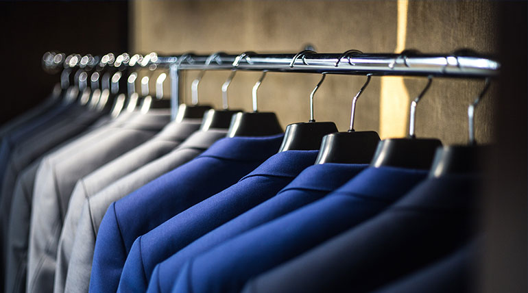 Blazers hanging on rail